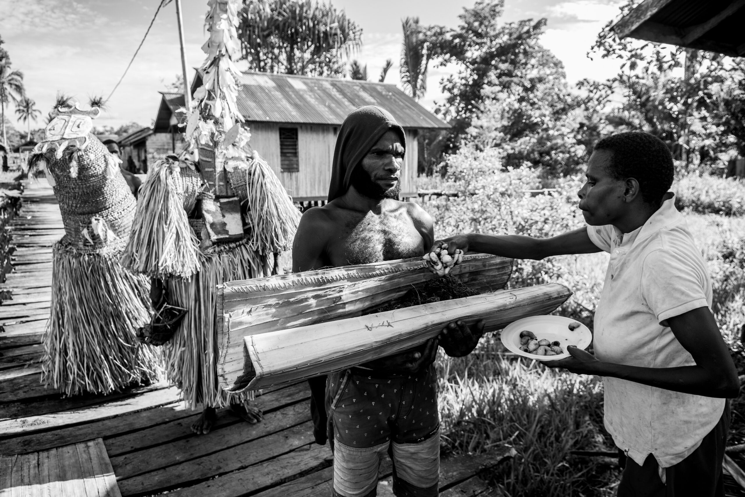 They give offerings of sago worms to the ancestral spirits.
