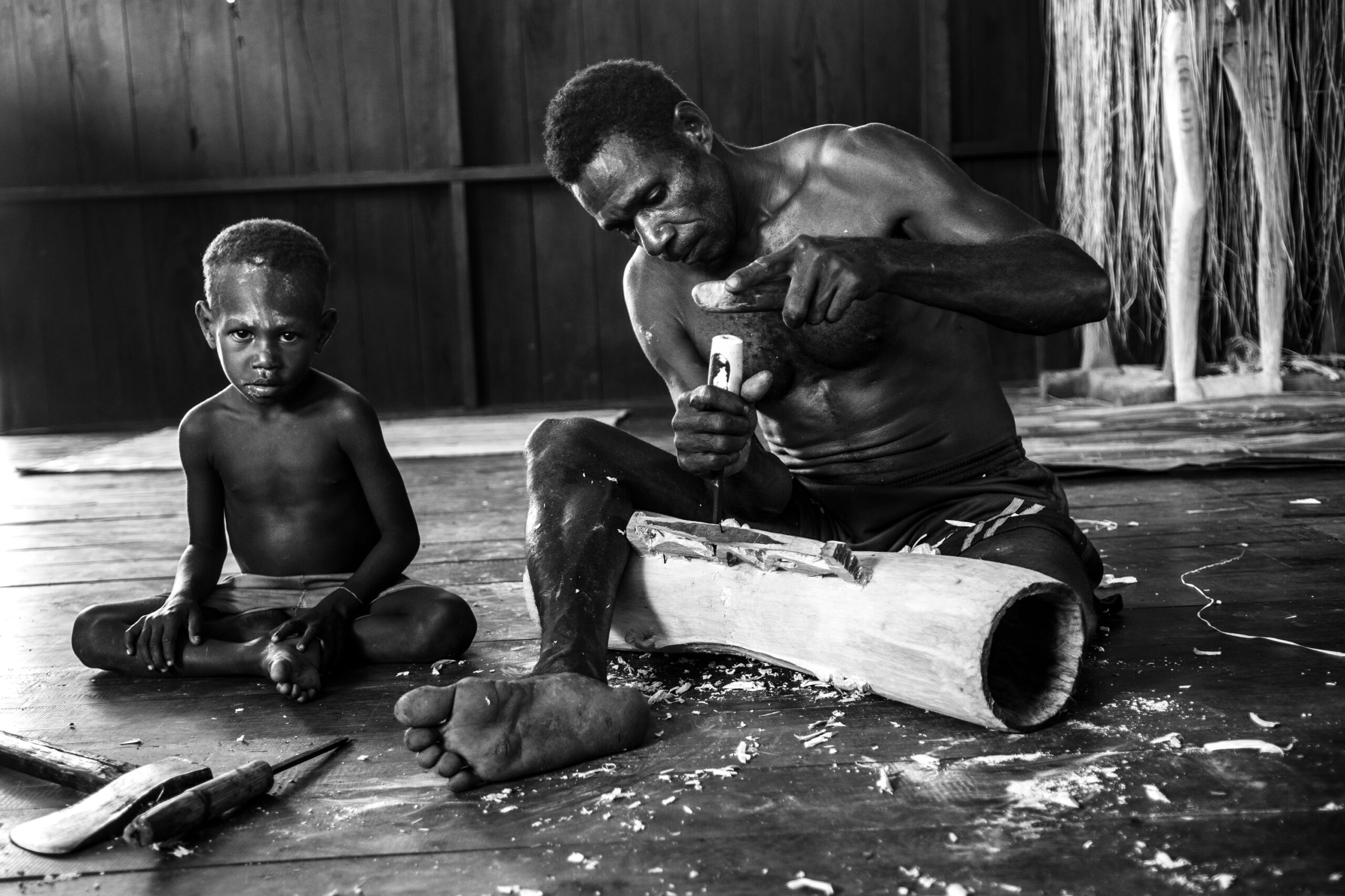 Timno, accompanied by his son, made a new Tifa to be presented to the ancestors.